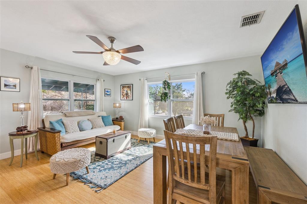 124 East Harding Street Orlando, FL 32806 - Photo 6 of 21 a living room with furniture potted plant and a large window