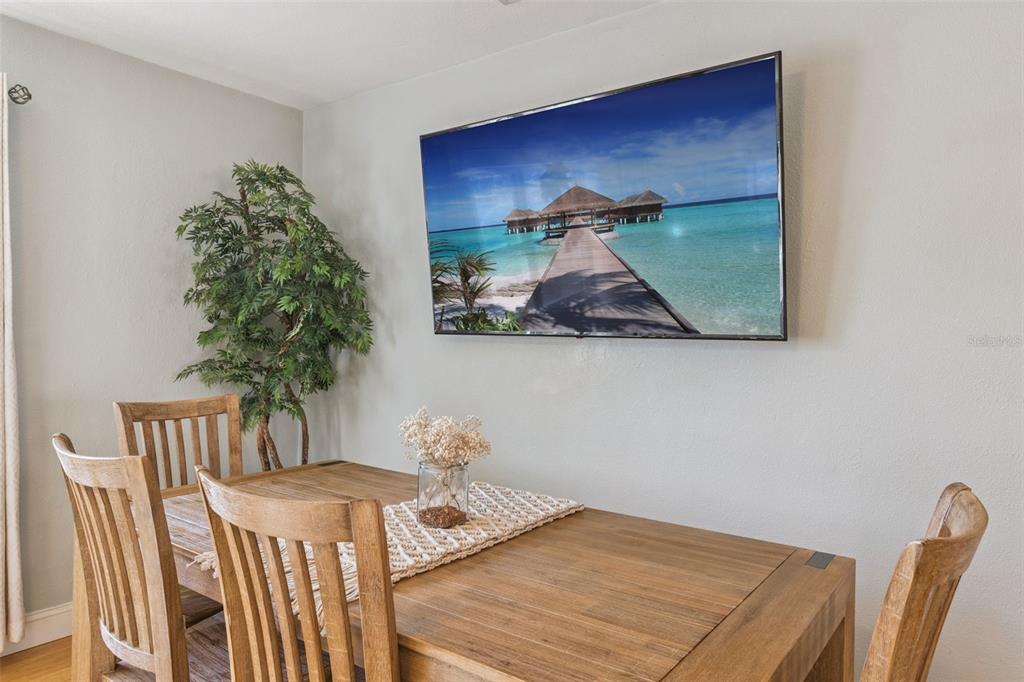 124 East Harding Street Orlando, FL 32806 - Photo 7 of 21 a bedroom with a bed and a table in it