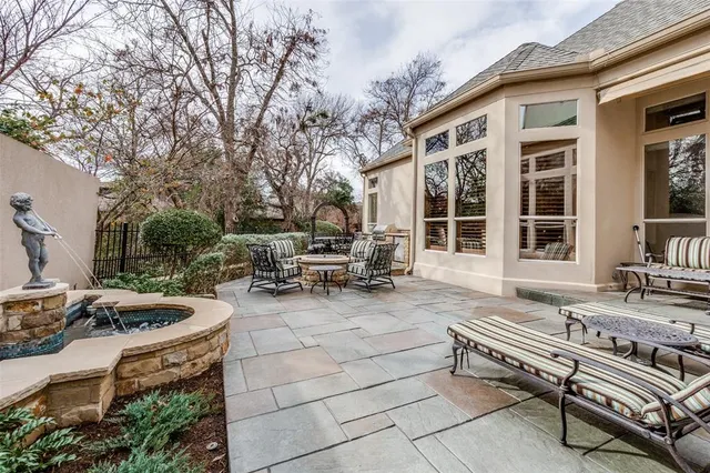 a view of a patio with chairs and tables