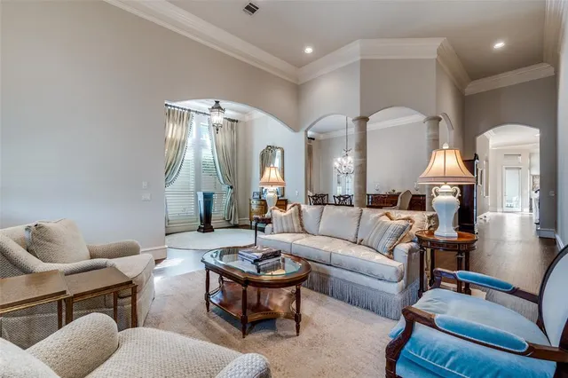 a living room with furniture and a mirror
