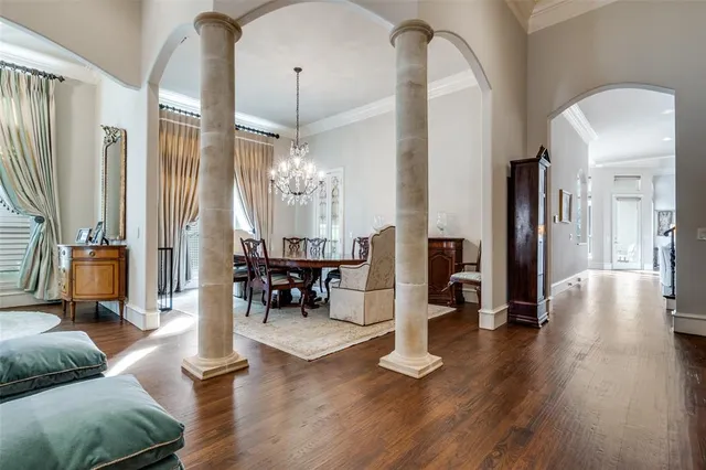 a living room with furniture or wooden floor and a chandelier