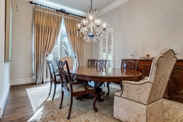 a view of a dining room with furniture and window