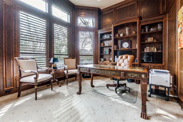 a work room with furniture and a bookshelf