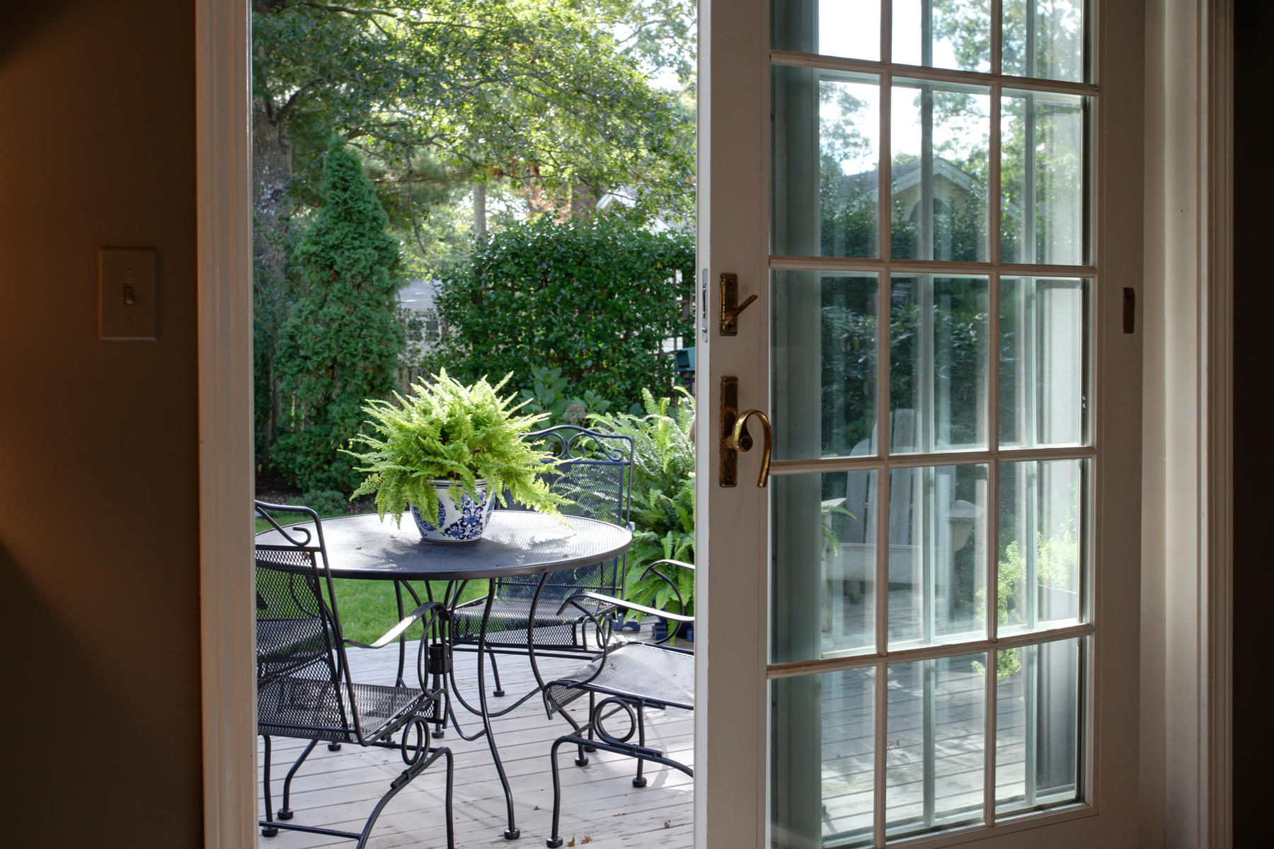 120 Fuller Road Centerville, MA 02632 - Photo 12 of 35 a view of a balcony with table and chairs potted plants with wooden floor