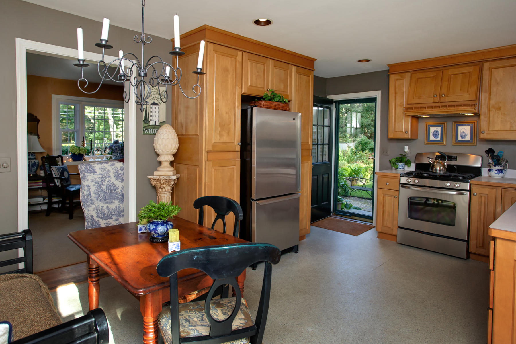 120 Fuller Road Centerville, MA 02632 - Photo 13 of 35 a kitchen with stainless steel appliances granite countertop a stove refrigerator and a dining table with wooden floor