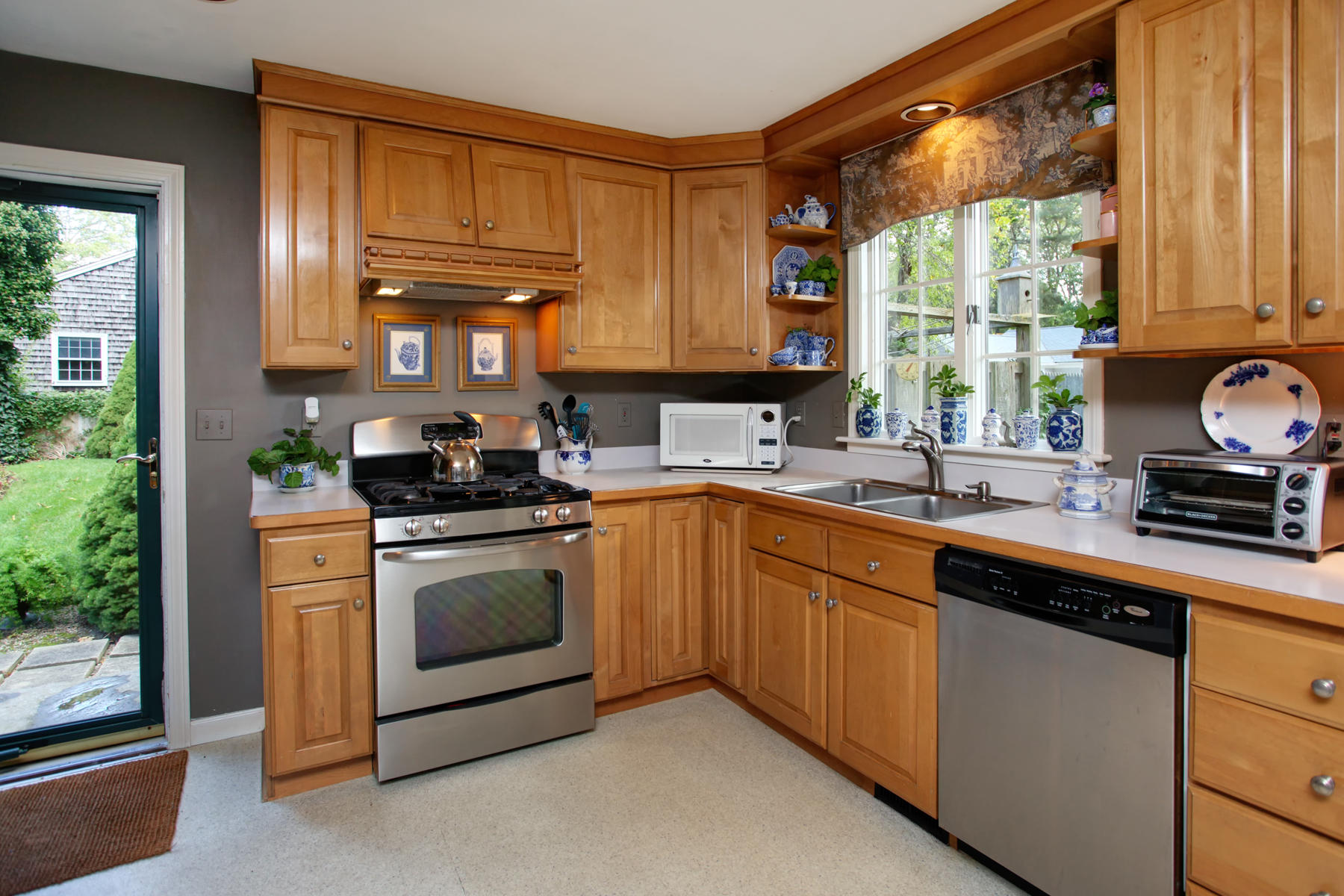 120 Fuller Road Centerville, MA 02632 - Photo 17 of 35 a kitchen with granite countertop a sink stainless steel appliances and cabinets