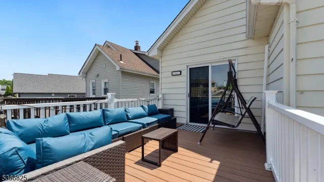 a view of a patio with couches and a potted plant on a table