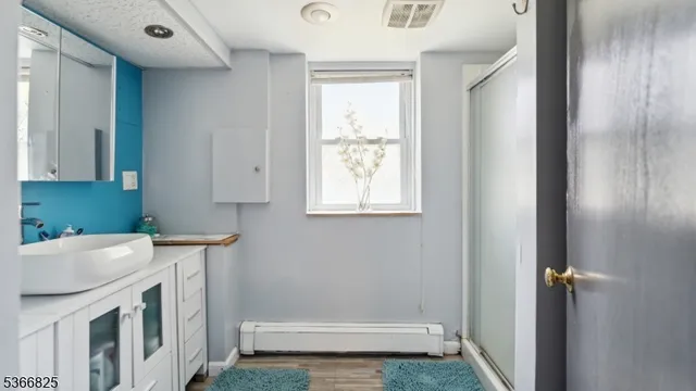 a bathroom with a sink toilet and tub