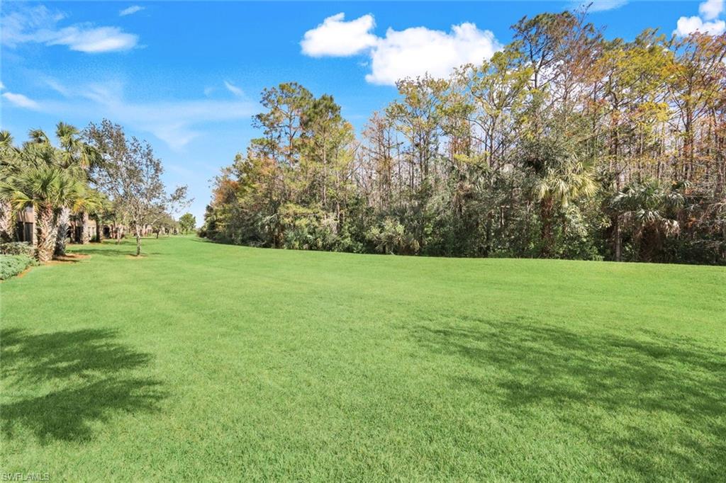 9532 Ironstone Terrace, Unit 102 Naples, FL 34120 - Photo 20 of 45 View of green lawn