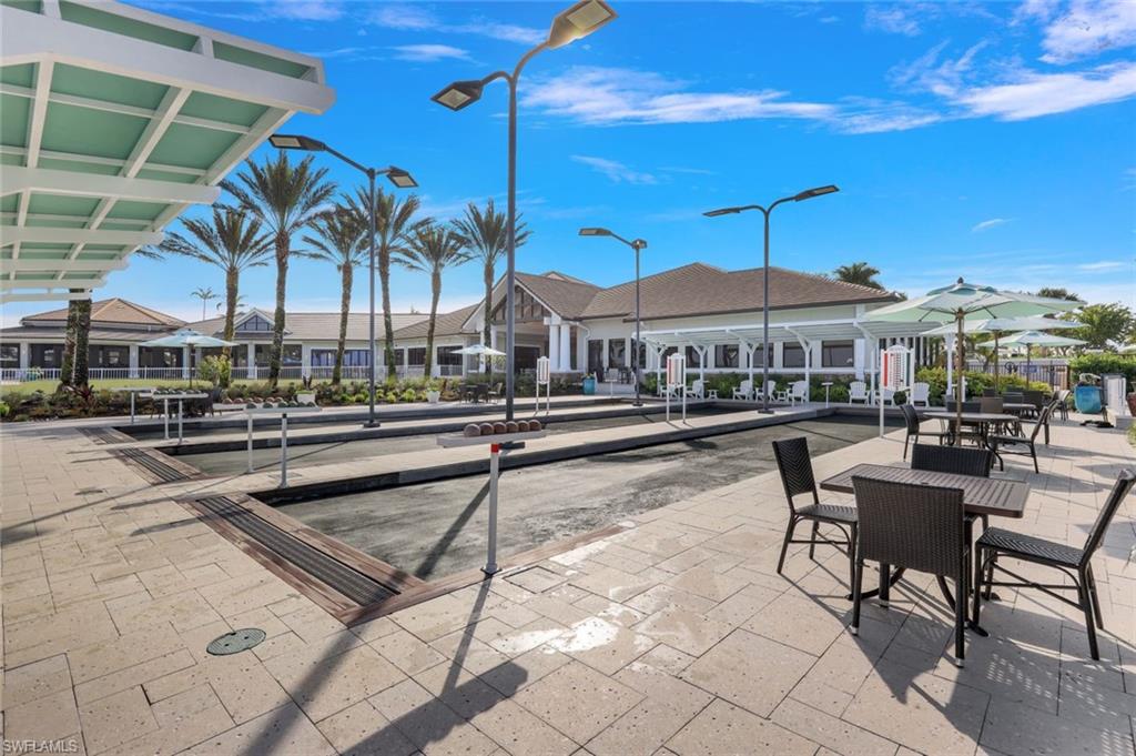 9532 Ironstone Terrace, Unit 102 Naples, FL 34120 - Photo 43 of 45 View of community with a game area and a residential view