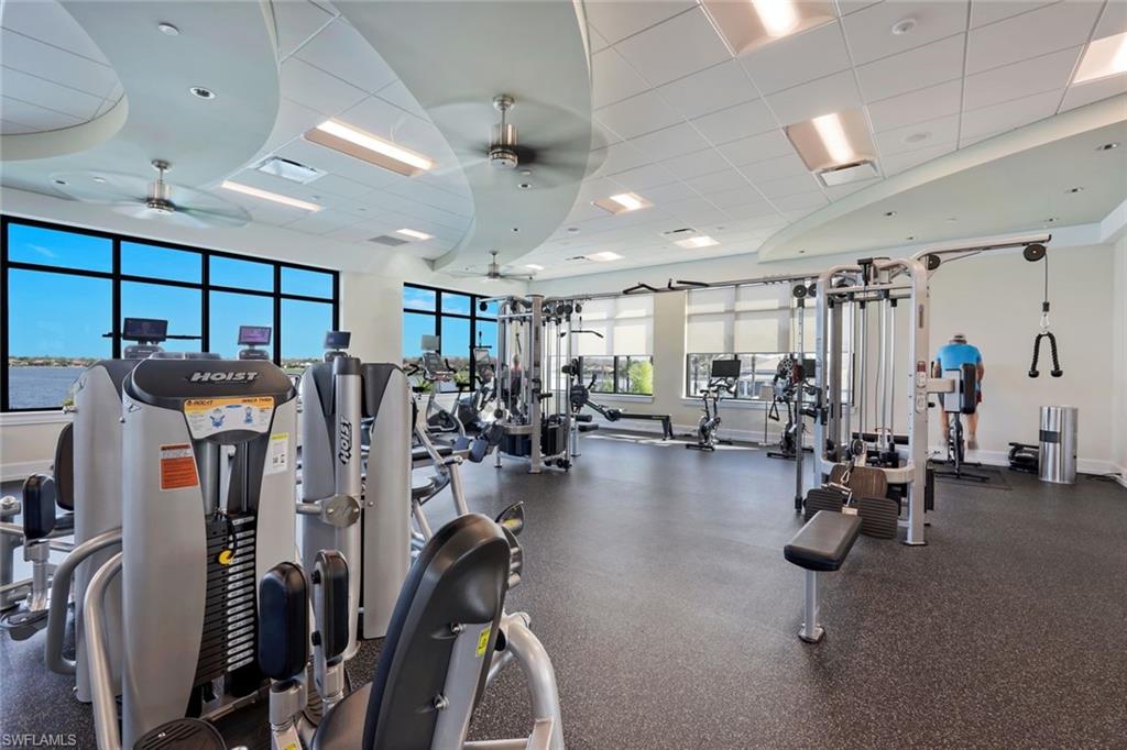 9532 Ironstone Terrace, Unit 102 Naples, FL 34120 - Photo 45 of 45 Gym with ceiling fan and a paneled ceiling
