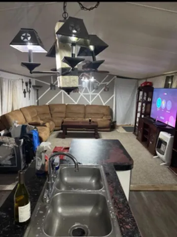 en suite bathroom with a tub and window