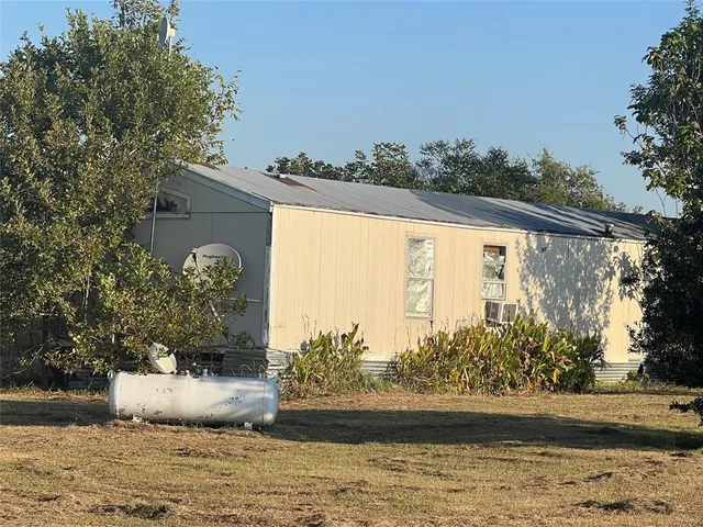 a view of outside space and a yard
