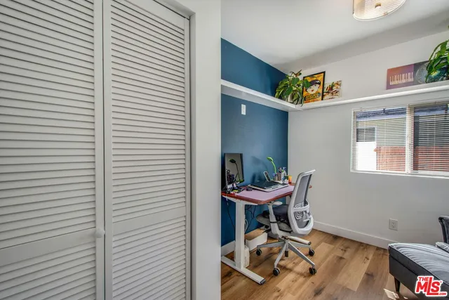 a work room with furniture and a window