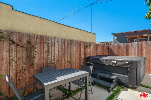a view of table and chairs in patio