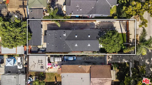 an aerial view of houses with outdoor space