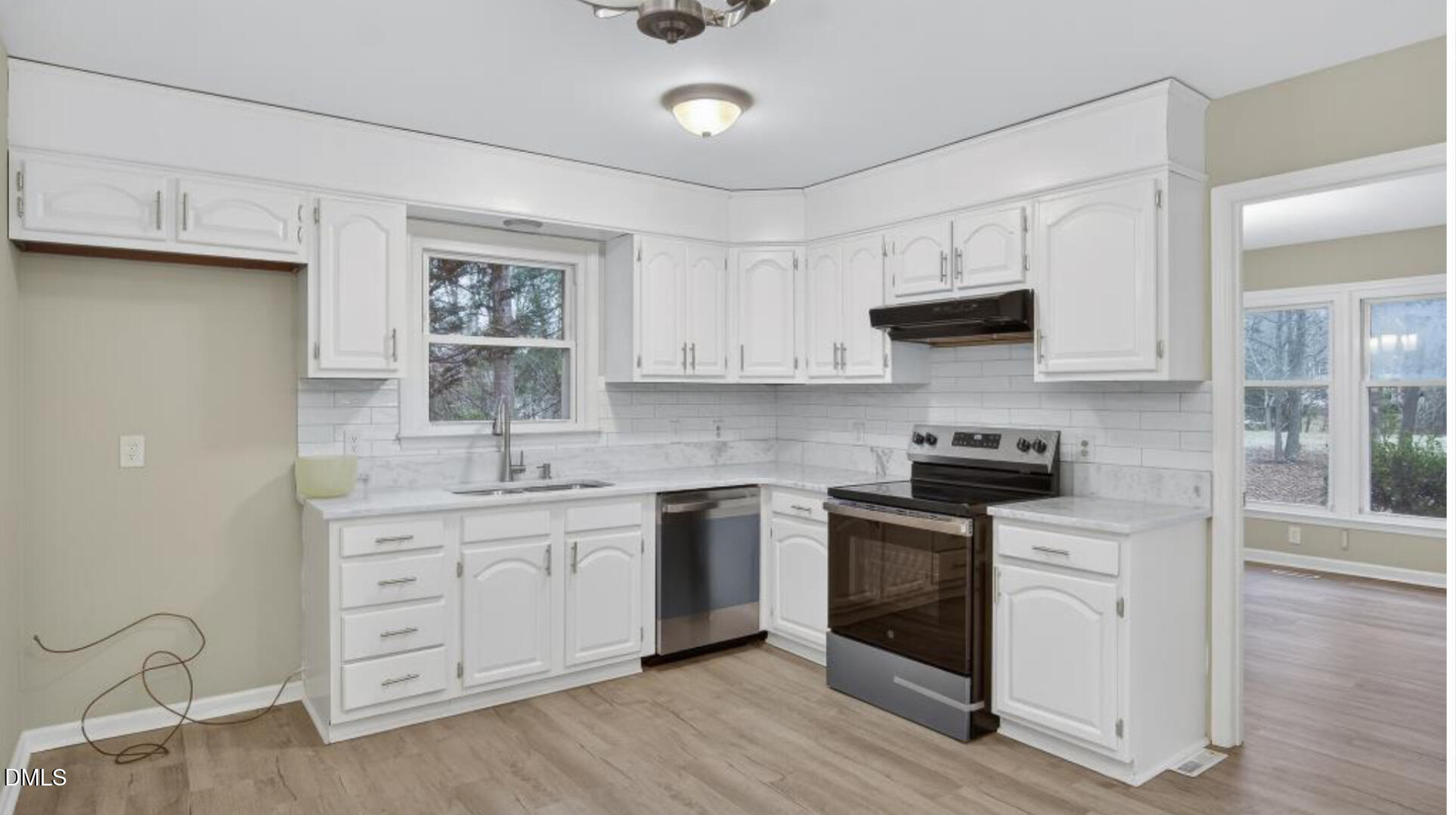 13013 Meadow Ridge Drive Rougemont, NC 27572 - Photo 8 of 27 a kitchen with stainless steel appliances granite countertop a stove sink and cabinets