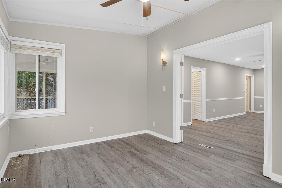 13013 Meadow Ridge Drive Rougemont, NC 27572 - Photo 10 of 27 a view of an empty room with wooden floor and a window