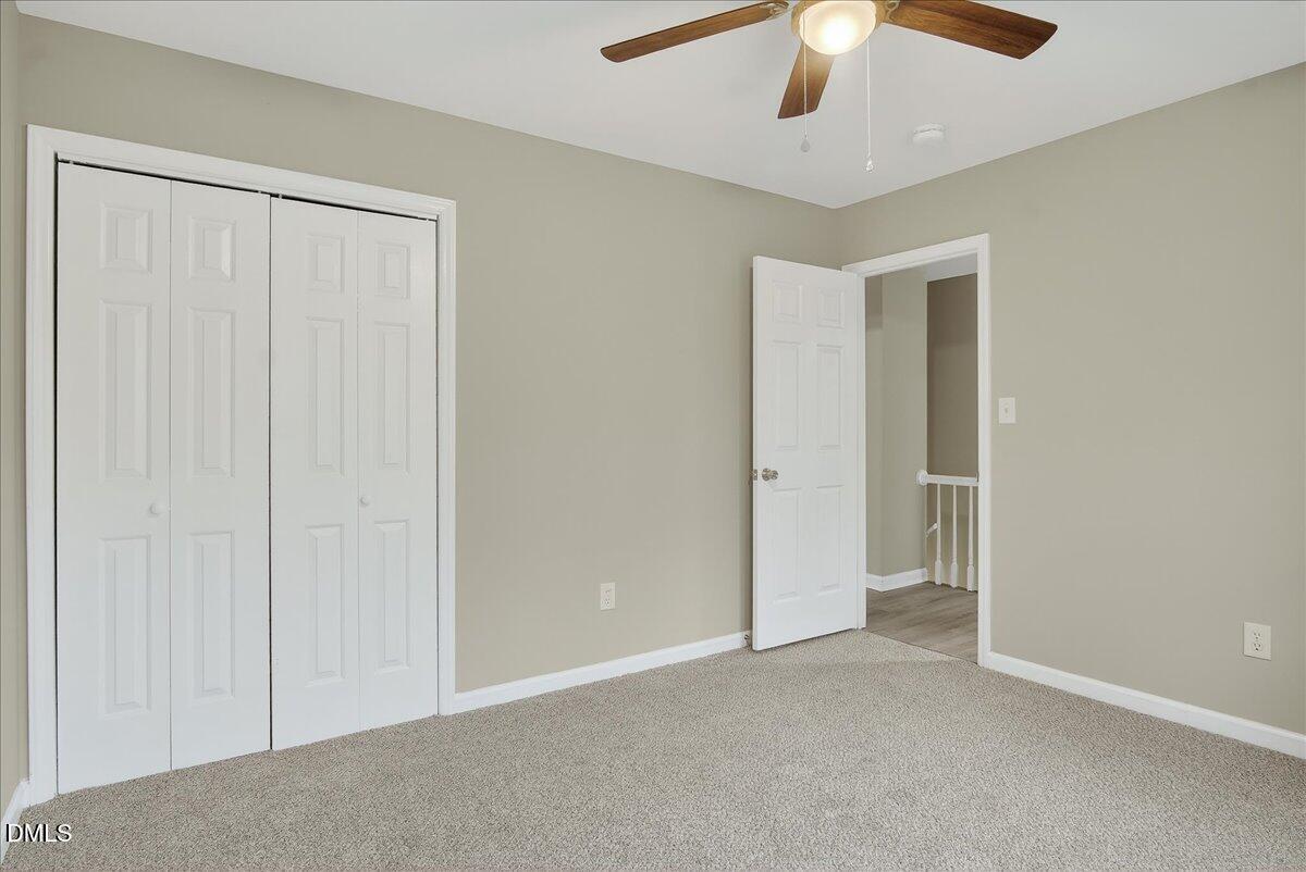 13013 Meadow Ridge Drive Rougemont, NC 27572 - Photo 14 of 27 an empty room with chandelier fan