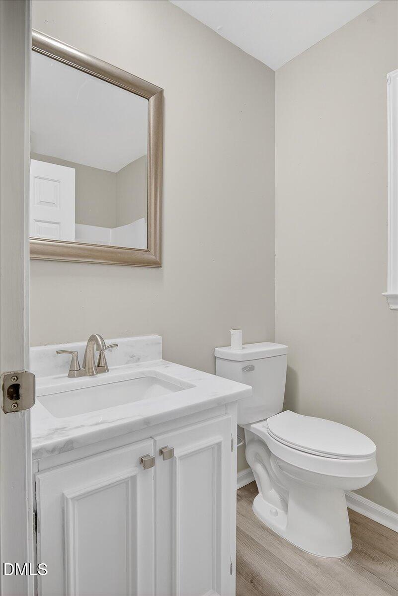 13013 Meadow Ridge Drive Rougemont, NC 27572 - Photo 15 of 27 a bathroom with a sink a toilet and mirror