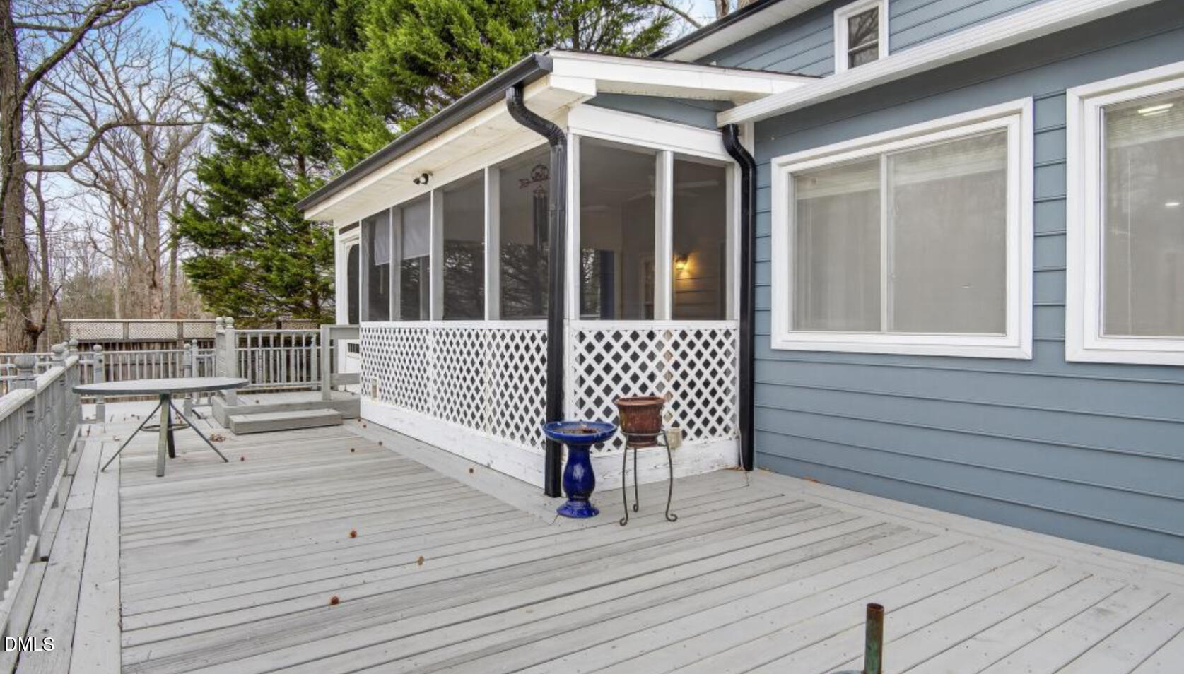 13013 Meadow Ridge Drive Rougemont, NC 27572 - Photo 18 of 27 a view of a deck with wooden floor and bench with wooden floor