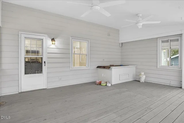 a view of a deck with wooden floor and bench with wooden floor