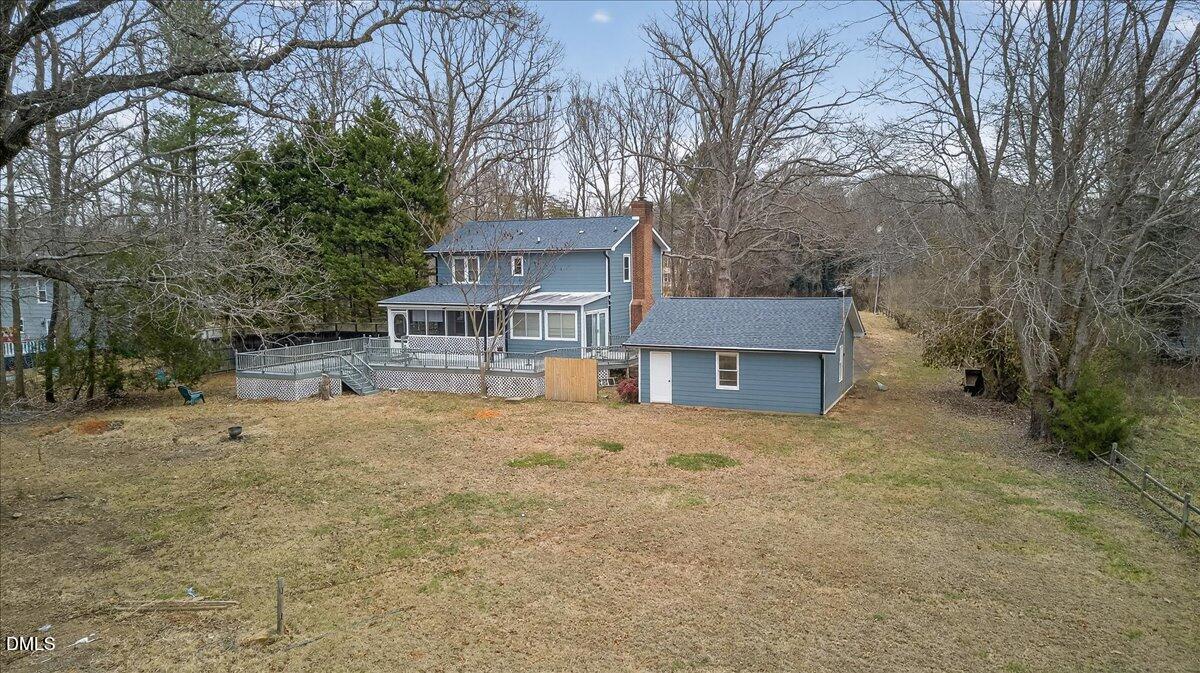 13013 Meadow Ridge Drive Rougemont, NC 27572 - Photo 22 of 27 a front view of a house with a yard and garage