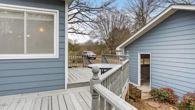 a view of a balcony with furniture