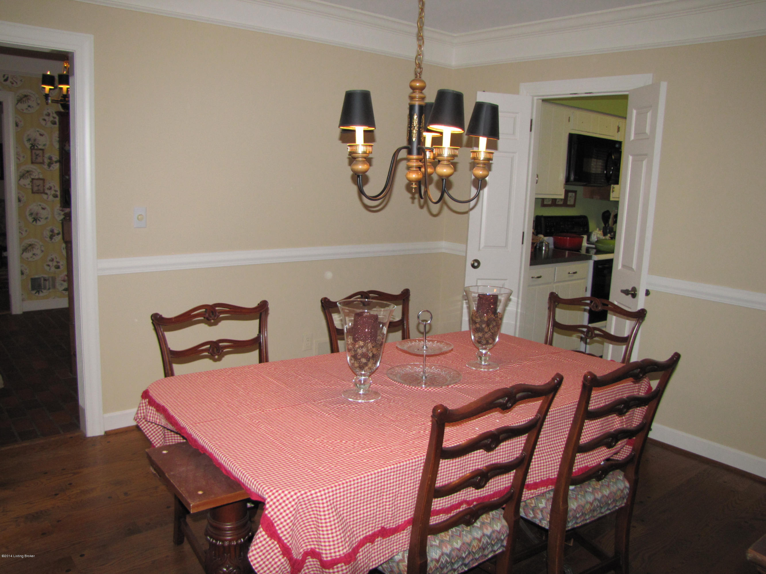 10710 Sun Ridge Road Goshen, KY 40026 - Photo 10 of 55 The Formal Dining Room is open to the Foyer and located off of the large Kitchen through a set of double doors; Chair rail trim adds a decorative formal compliment to this space