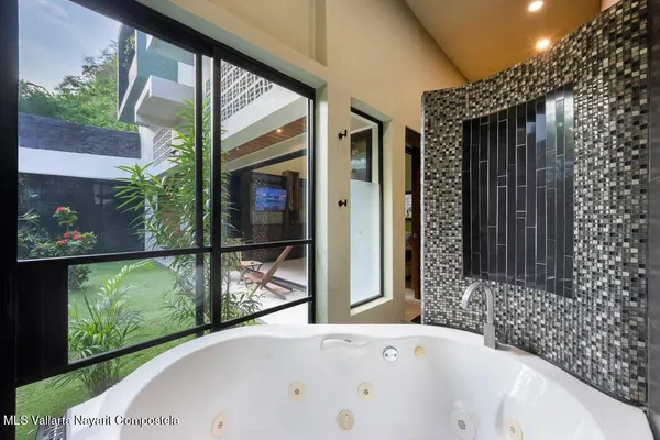 a bathroom with a bathtub and a shower