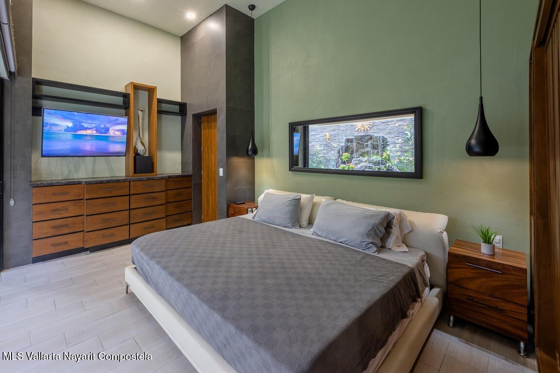 31 Invierno Davisburg, undefined 48350 - Photo 12 of 37 a bedroom with a bed and a flat screen tv