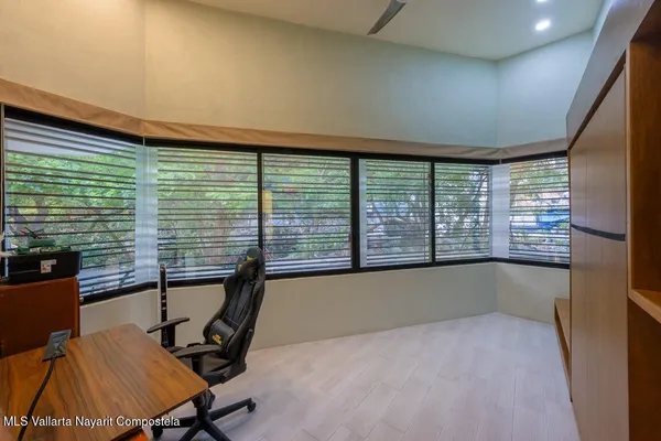 a view of a room with a large window
