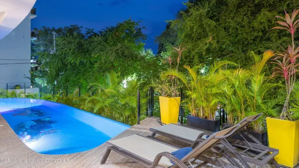 a view of a swimming pool with a patio