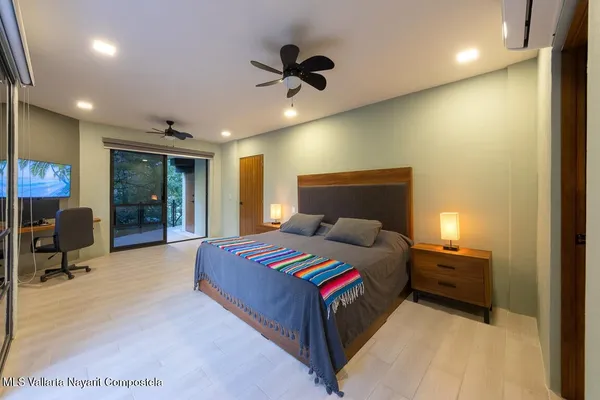 a bedroom with a bed and furniture