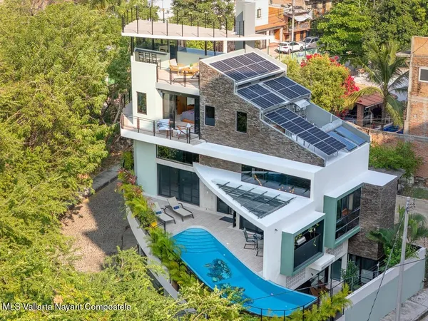 an aerial view of a house with a garden