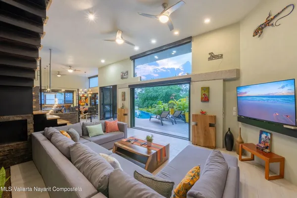 a living room with furniture and a flat screen tv