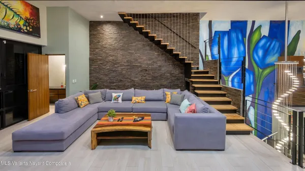 a outdoor living space with furniture and a book shelf