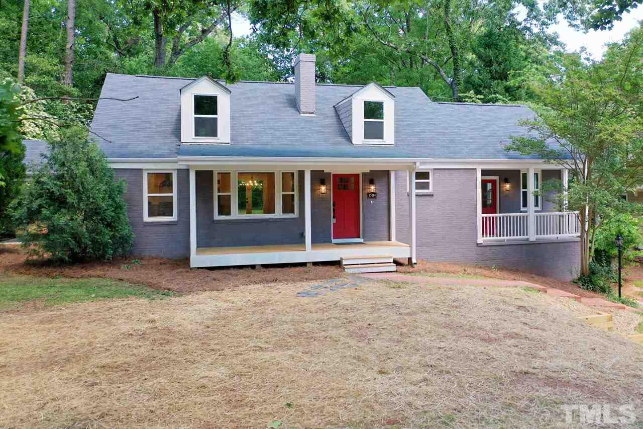1304 Dixie Trail Raleigh, NC 27607 - Photo 2 of 26 front view of a house with a yard