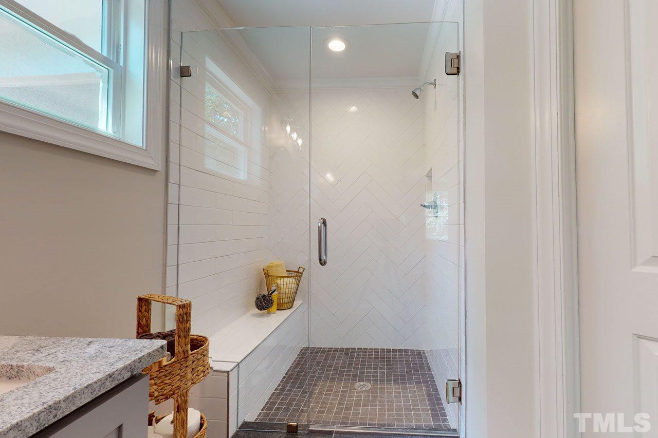 1304 Dixie Trail Raleigh, NC 27607 - Photo 14 of 26 a bathroom with a granite countertop sink a toilet and shower