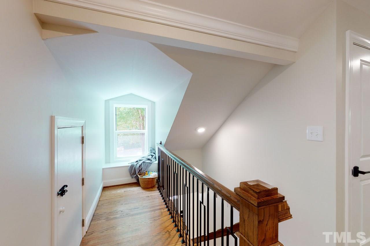 1304 Dixie Trail Raleigh, NC 27607 - Photo 16 of 26 a view of a hallway with wooden floor and entryway