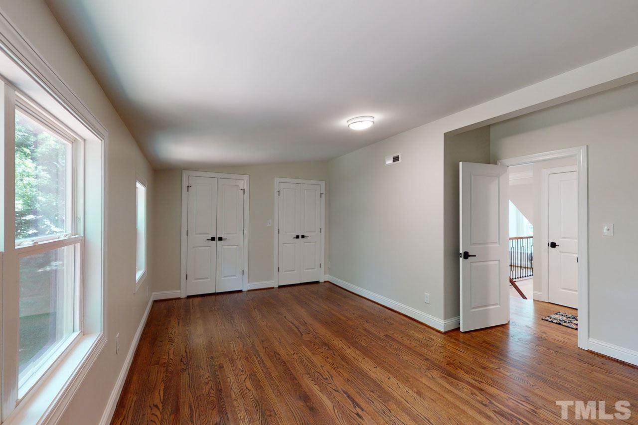 1304 Dixie Trail Raleigh, NC 27607 - Photo 18 of 26 wooden floor in an empty room with a window