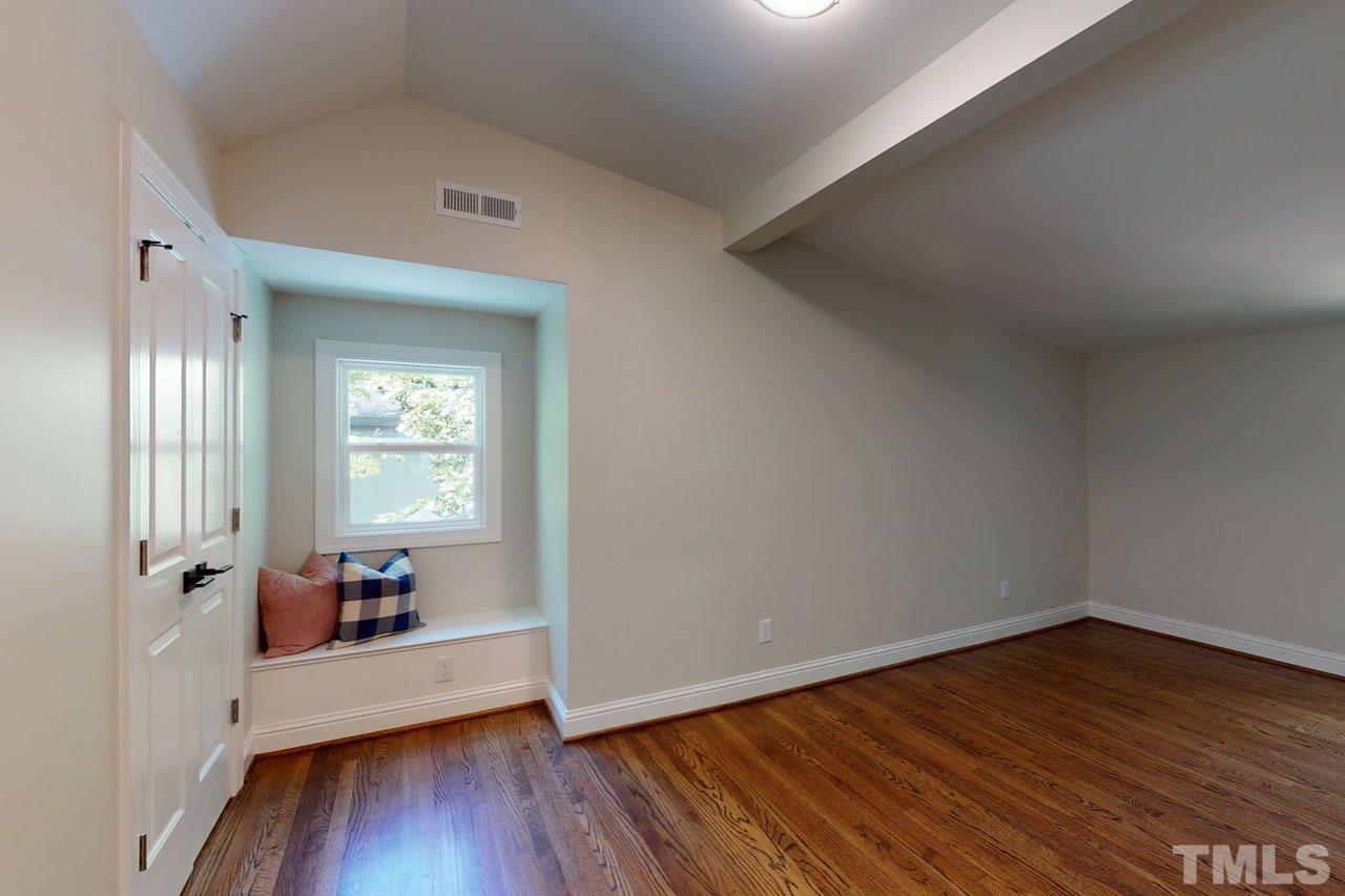 1304 Dixie Trail Raleigh, NC 27607 - Photo 19 of 26 a view of a room with wooden floor and window