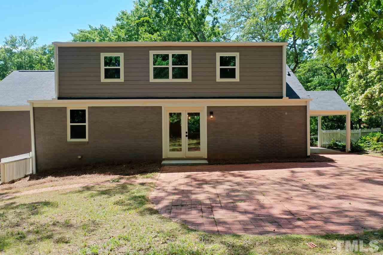 1304 Dixie Trail Raleigh, NC 27607 - Photo 23 of 26 a front view of a house with a yard