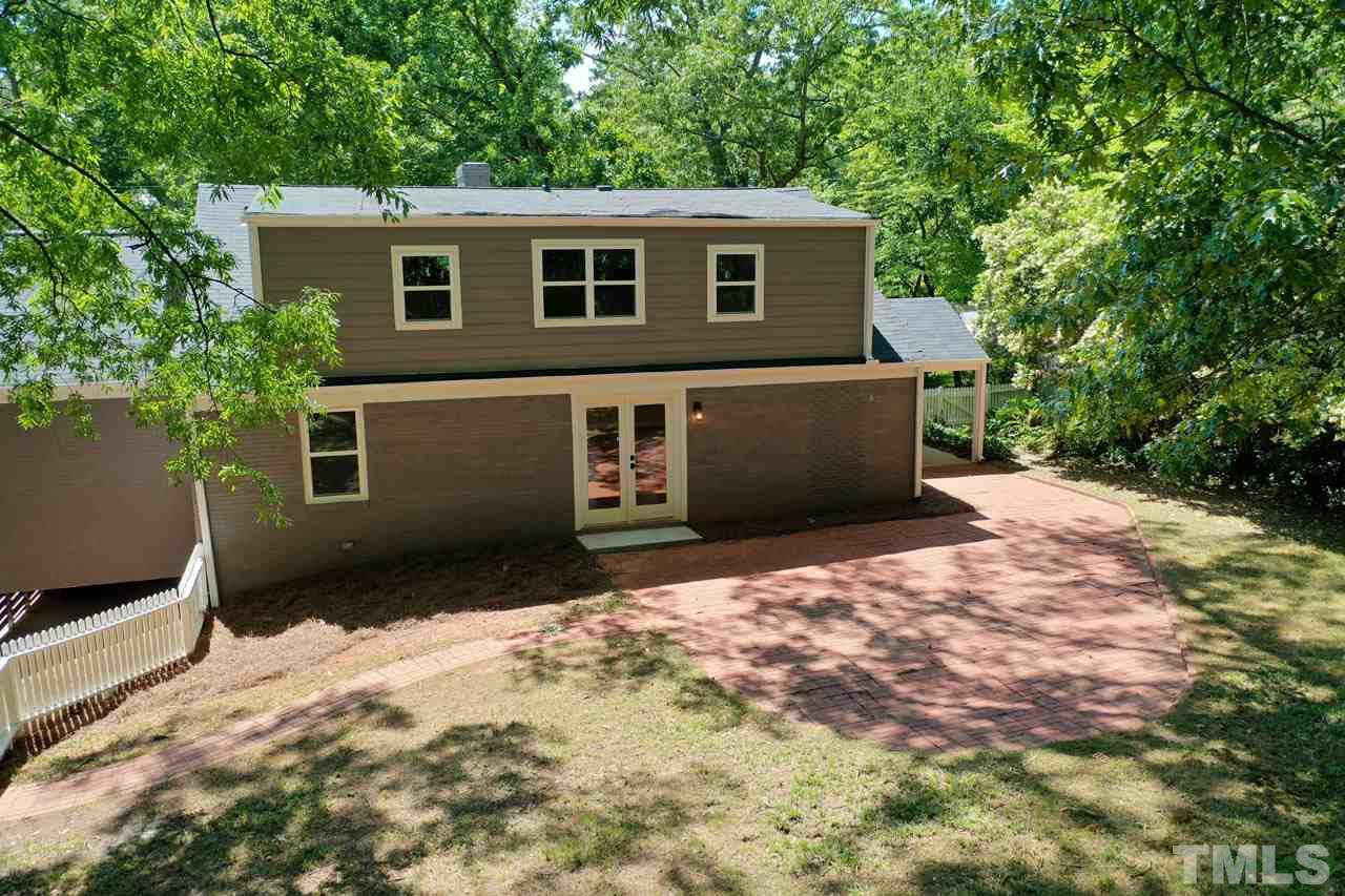 1304 Dixie Trail Raleigh, NC 27607 - Photo 24 of 26 a front view of a house with a yard