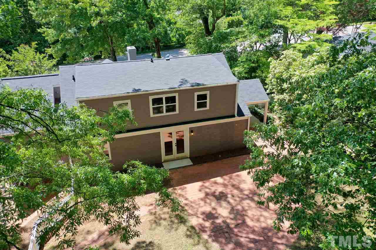 1304 Dixie Trail Raleigh, NC 27607 - Photo 25 of 26 an aerial view of a house with yard and trees in the background