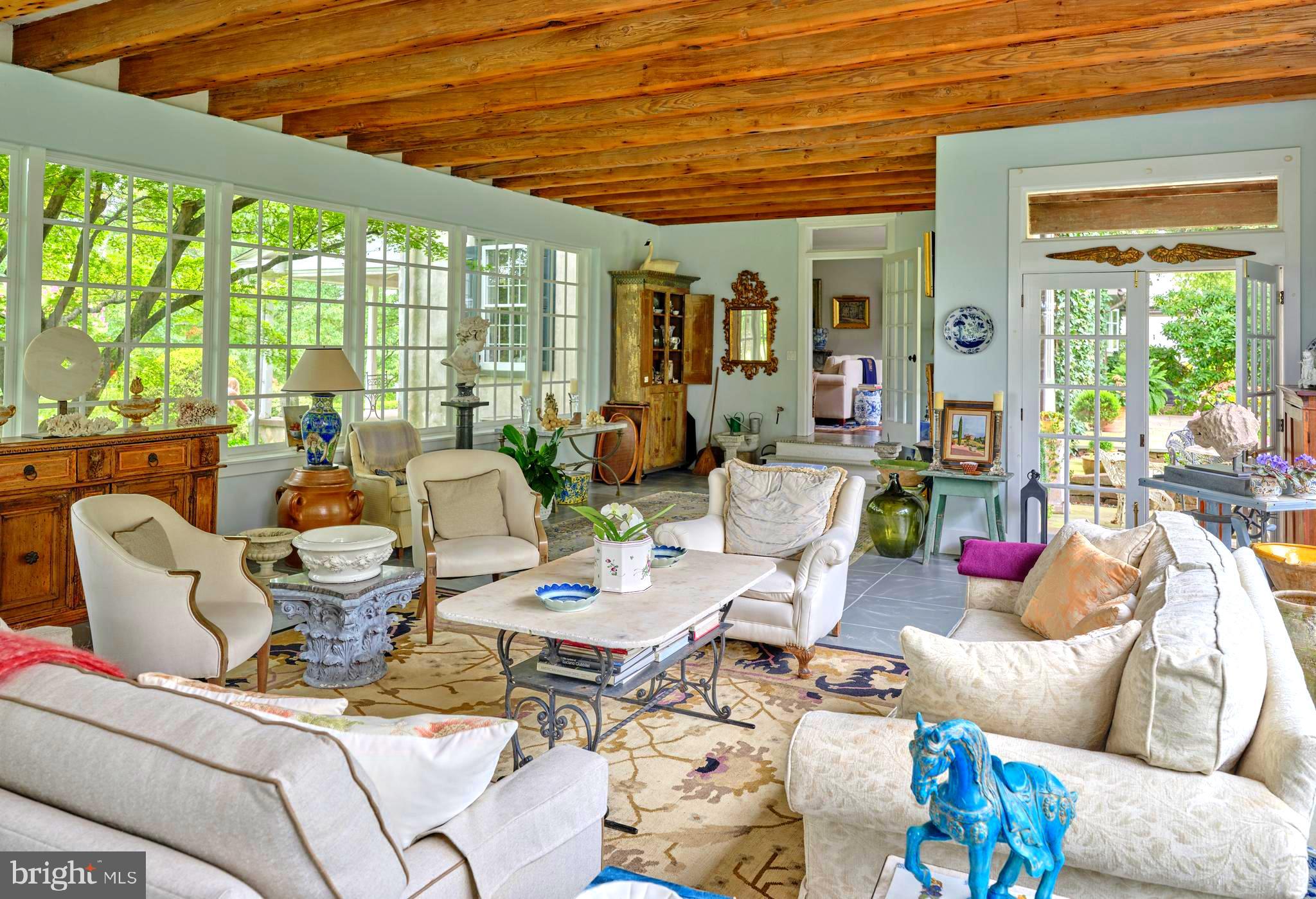 5382 Wismer Road Pipersville, PA 18947 - Photo 15 of 67 a living room with furniture and floor to ceiling windows