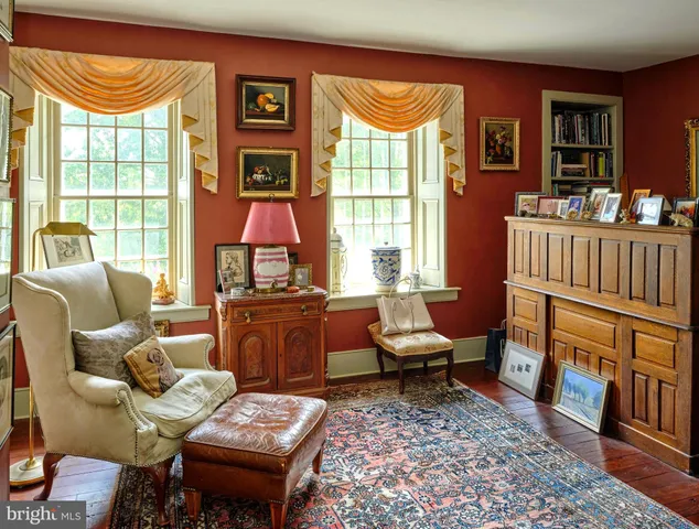 a living room with furniture fireplace and flat screen tv