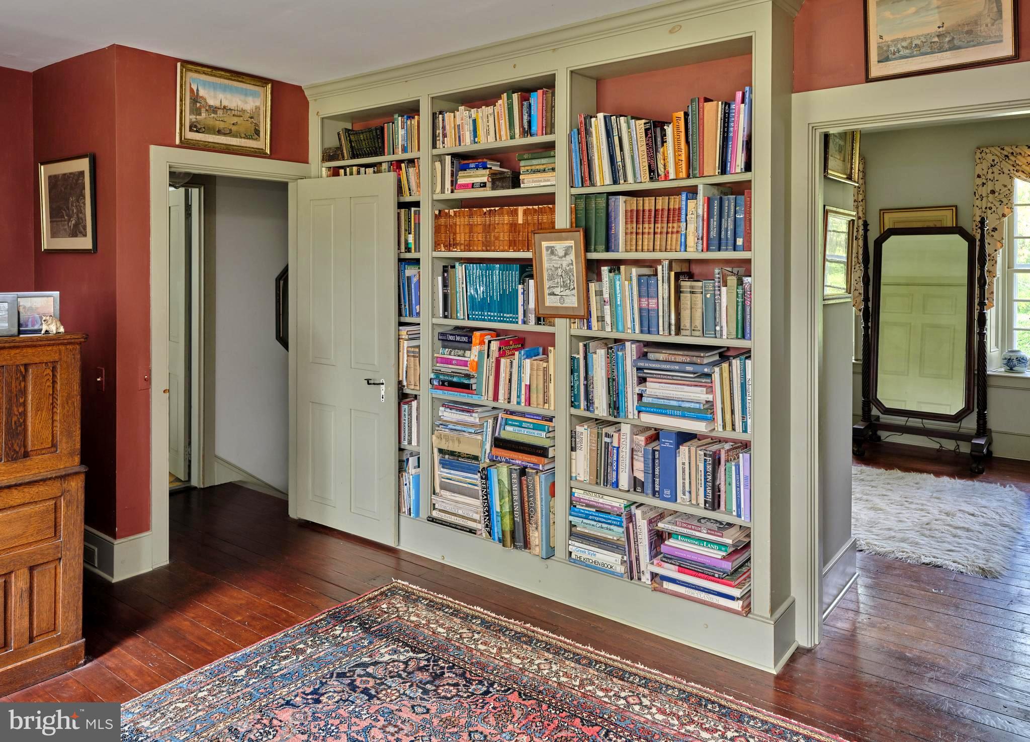 5382 Wismer Road Pipersville, PA 18947 - Photo 23 of 67 a view of room with furniture book shelf and wooden floor