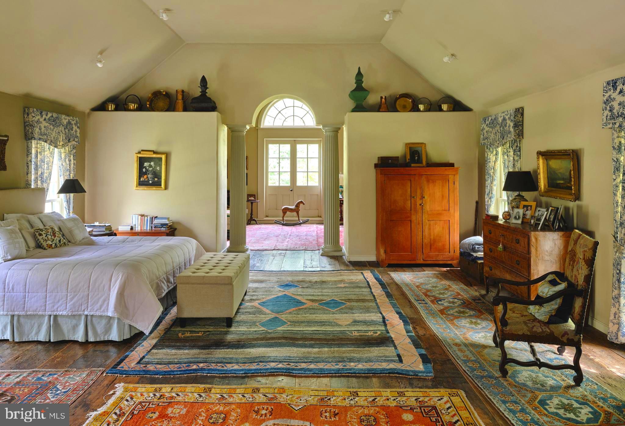5382 Wismer Road Pipersville, PA 18947 - Photo 24 of 67 a spacious bedroom with a bed and wooden floor