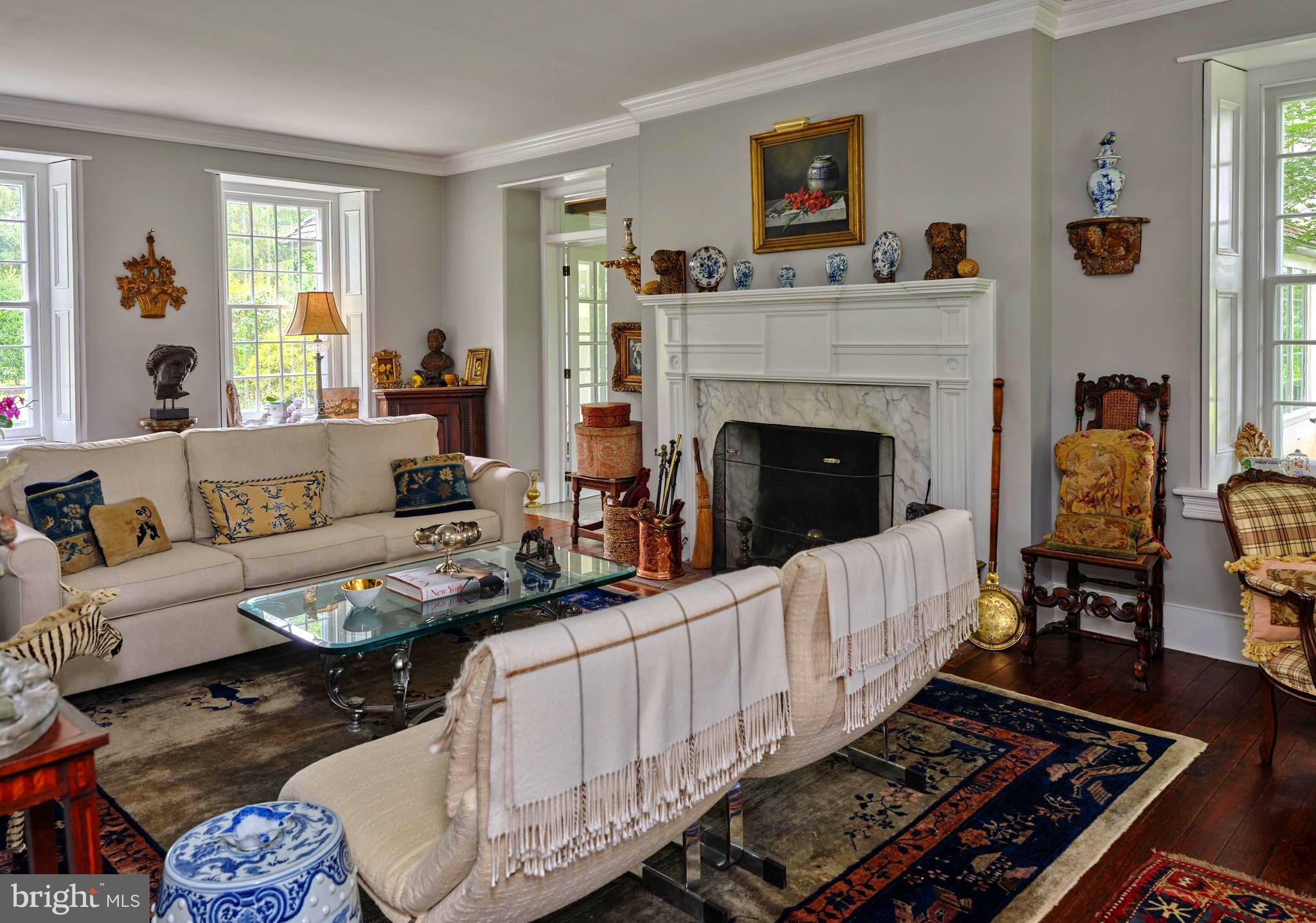 5382 Wismer Road Pipersville, PA 18947 - Photo 25 of 67 a living room with furniture and a fireplace